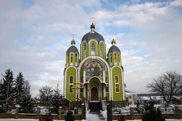 Beautiful old church on a background of winter nature in good weather