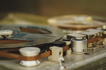 Old vintage reel-to-reel player. Tape recorder with spools. Bobbin tape recorder.	