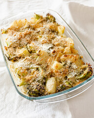 Broccoli, potato and vegan cheese pie in a glass pan