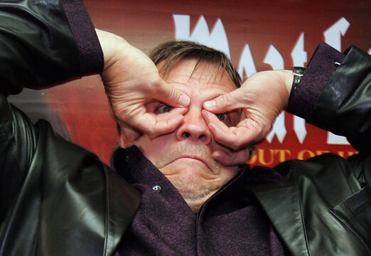 US rock and roll singer Meat Loaf gestures during news conference in Hong Kong