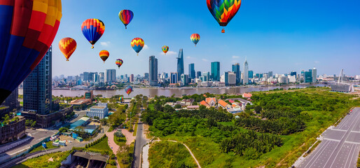 aerial view of colorful hot air balloons flying over Ho Chi Minh city, Vietnam. aerial view of...