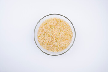 rice in glass bowl isolated on white background. rice in the kitchen
