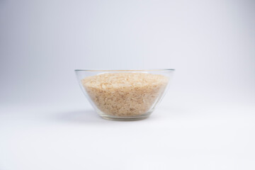 rice in glass bowl isolated on white background. rice in the kitchen