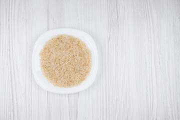 rice in a white plate on the table free space