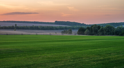 Irrigation system on the field of  a sod grass farm. Selective focus.