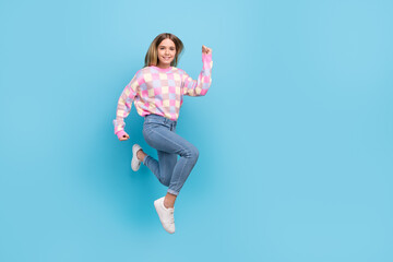 Fototapeta na wymiar Full length body size view of attractive girly cheerful girl jumping running copy space isolated over bright blue color background