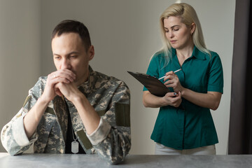 Soldier sitting on the sofa during psychological therapy