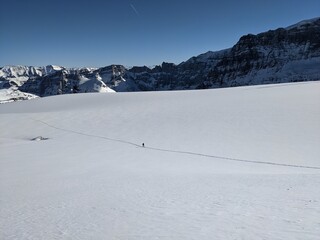  ski tour on the big clariden glacier in swiss in the cantons of uri and glarus. Mountaineering in winter. Piz Russein - obrazy, fototapety, plakaty