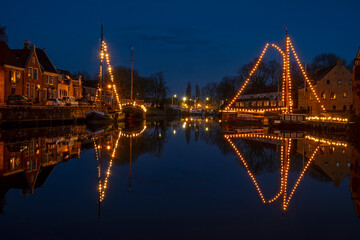 Fototapeta premium Historical city Dokkum in christmas time in the Netherlands at night