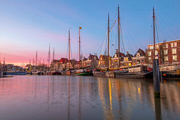 Fototapeta na wymiar City scenic from the harbor in Harlingen in the Netherlands at sunset