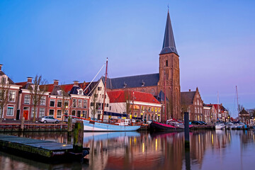 View on St. Michaels church in the city Harlingen in Friesland the Netherlands at sunset