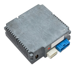 Metallic car engine control unit with plastic elements on a white isolated background is connecting center of various subsystems, units and assemblies. Monitoring the state of the moment. Spare part