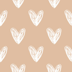 Vector seamless pattern with hand drawn white hearts on beige background.Valentines day design,wrapping paper,textile,fabrics texture.Delicate modern style