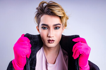 Portrait of stylish fashion man confident and self-acceptance with his gender identity in studio white background - obrazy, fototapety, plakaty
