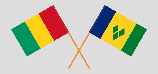 Crossed flags of Saint Vincent and the Grenadines and Guinea. Official colors. Correct proportion