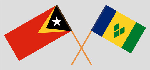 Crossed flags of East Timor and Saint Vincent and the Grenadines. Official colors. Correct proportion