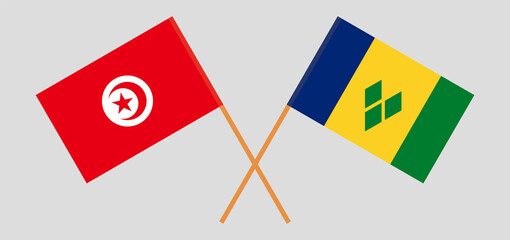 Crossed flags of Tunisia and Saint Vincent and the Grenadines. Official colors. Correct proportion