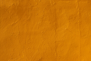texture of an orange yellow wall with agglomerated granite