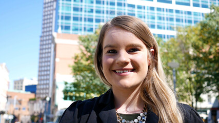 Beautiful Corporate Woman Smiling At Camera In Downtown Area