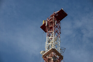 Fototapeta na wymiar Telecommunications antenna for radio, television and telephony whit cloud and Blue sky