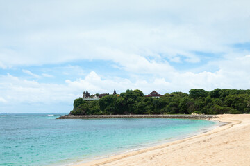 Scenery of sunny day with sand beach, turquoise ocean and sky with cloud. Nusa dua beach, Bali island, Indonesia. Tropical landscape. Wallpaper background. Natural scenery. Romantic relax place. Waves