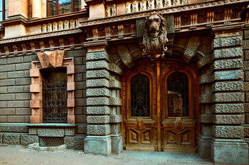 Fototapeta na wymiar Ancient wooden door with iron bars in to historical house in Odessa Ukraine.