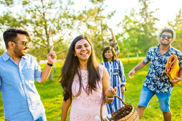 multiethnic people spending time together playing guitar