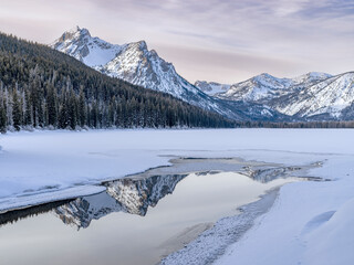 Frozen Stanley lake with a pool of water reflection
