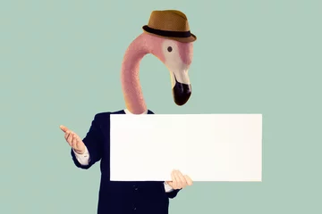 Fotobehang Happy smiling young business man with the head of a pink flamingo in a straw hat showing blank signboard © filins