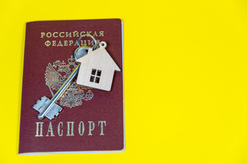 Russian passport with the inscription: Russian Federation. Keys to the apartment, house. Buying, selling, renting real estate.
