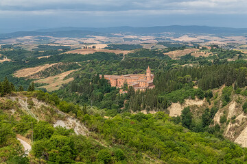 Fototapeta na wymiar Monte Oliveto Maggiore idyllic monastery surrounded by olive groves in the Crete Senesi