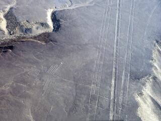 Peru Nazca lines geoglyph Hummingbird in Nasca valley aerial view. Ancient drawings of Nasca...