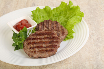 Grilled beef burger cutlet with sauce