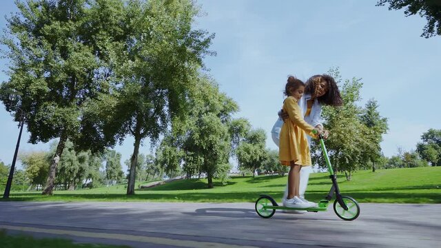 Beautiful Happy African American Family Bonding At The Park. Parents, Grandparents And Kids Spending Time Outdoor Playing And Having Fun