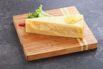 Parmesan cheese piece over board