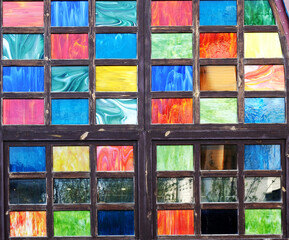 Stained glass multi-colored mosaic windows wall, texture background