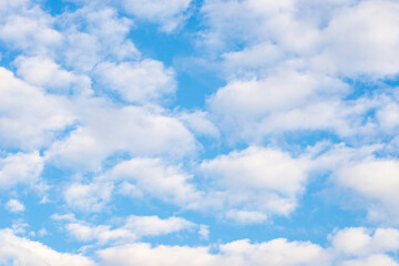 White cute clouds on blue sky