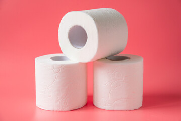 Toilet paper on pink background
