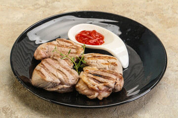 Grilled pork tenderlion with tomato sauce