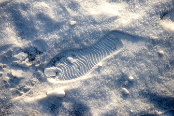 Fresh prints of shoes. The danger of walking in the snow.