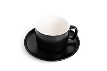 Black empty tea cup and saucer for drink isolated on white background. Ceramic coffee cup or mug...