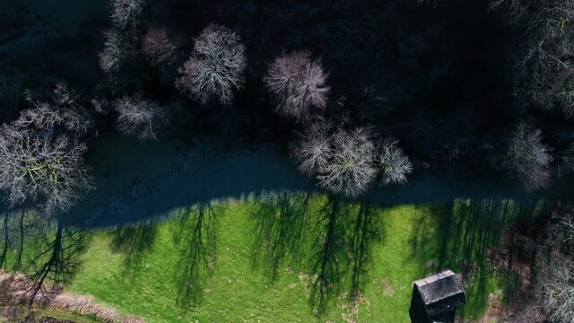 Winter landscape of forests and Pasiega cabins in the Pisue&ntilde;a River Valley. Pasiegos Valleys, Cantabria, Spain, Europe