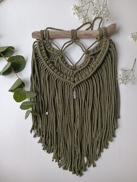 macrame wallhanging in the wood backround