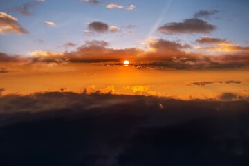 the sun is bright against the background of the sky and cloud