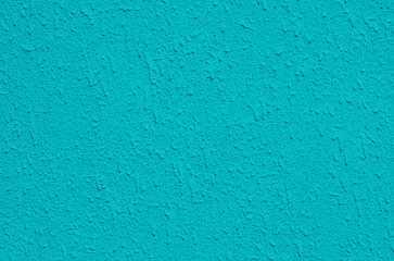 Turquoise wall with decorative texture, place for text