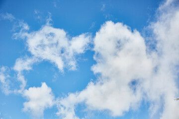 White fluffy clouds in a dark blue sky. Several clouds. Resources for matte painting.