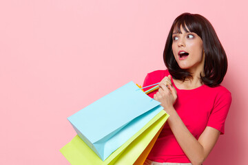 portrait woman with colorful shopping bags isolated background