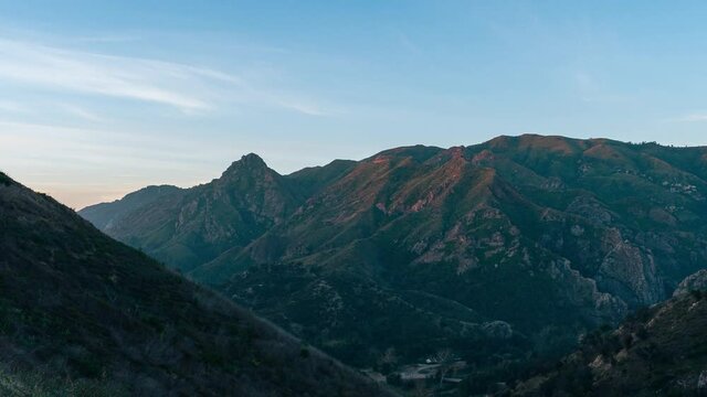 time lapse view of sunrise over green Santa Monica Mountain Range at Malibu Creek State Park near Calabasas California 