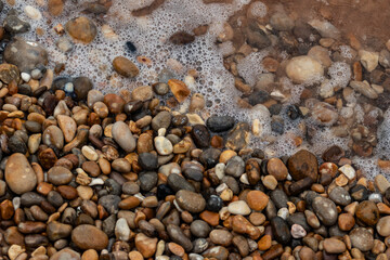 Pebbles in surf