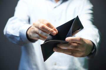 economic crisis. Business Person holding or showing an empty wallet. Bankruptcy 